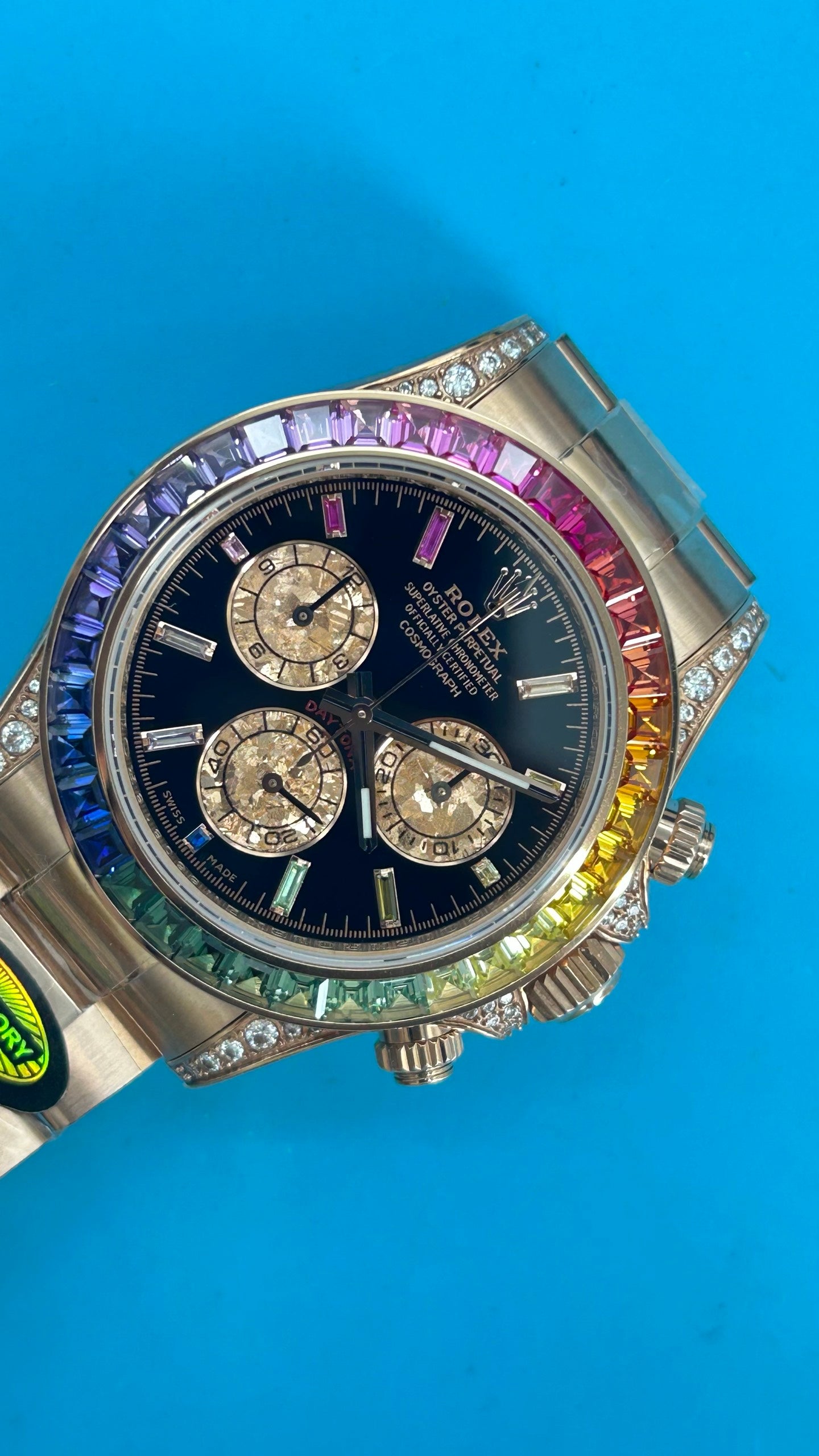 Rolex Daytona « Rainbow » MZ SUPER CLONE Or Rose Cadran Noir Lunette Saphir